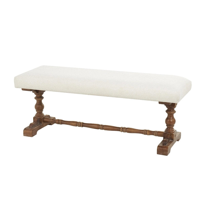 Banco tapizado color crema con patas torneadas marrones