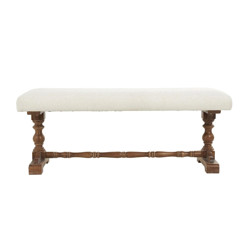 Banco tapizado color crema con patas torneadas marrones