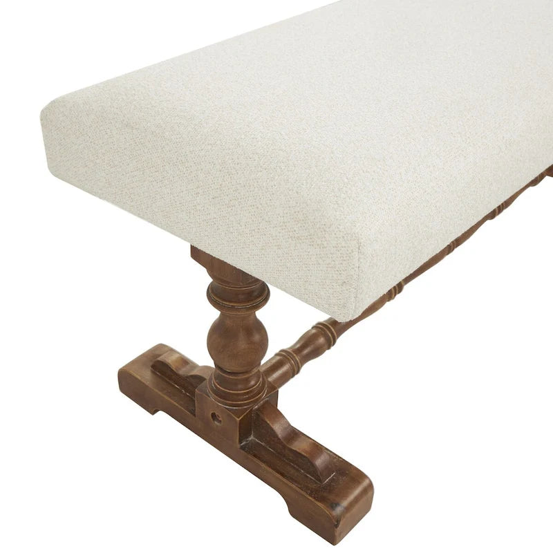 Banco tapizado color crema con patas torneadas marrones