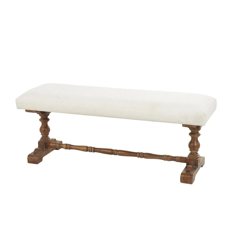 Banco tapizado color crema con patas torneadas marrones